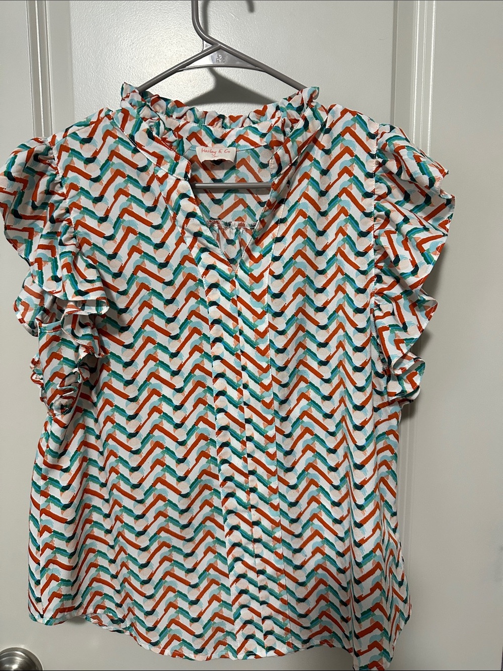 Ruffled Chevron Print Blouse in White, Teal & Orange